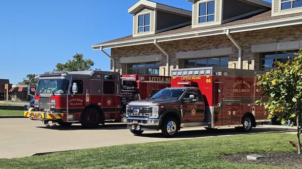 Engine and ambulance outside the firehouse