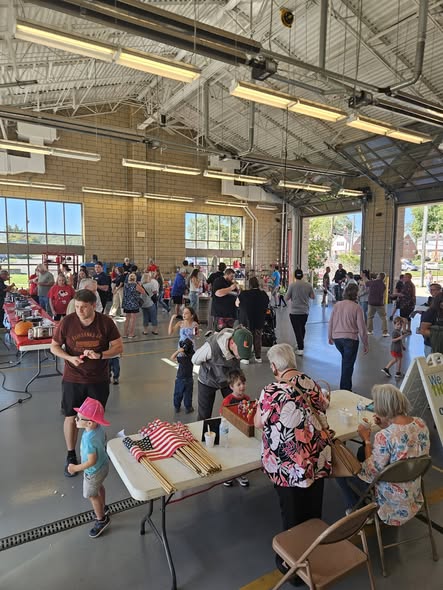Neighbors gathering inside Station 66 for the 2026 chili cook-off